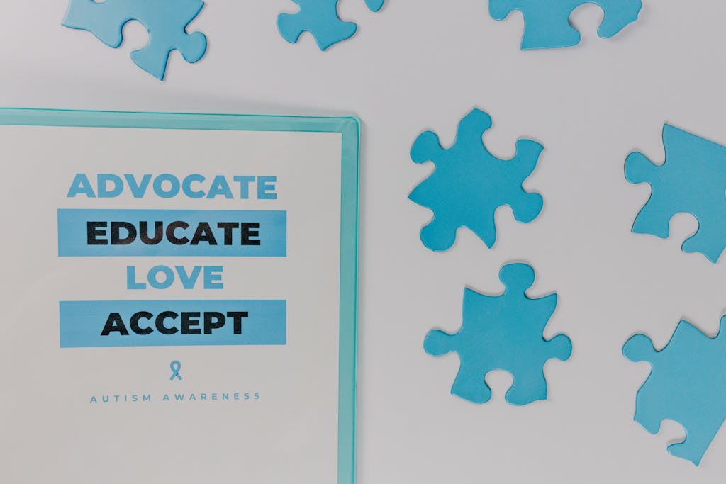 Close-up of autism awareness poster with blue puzzle pieces.